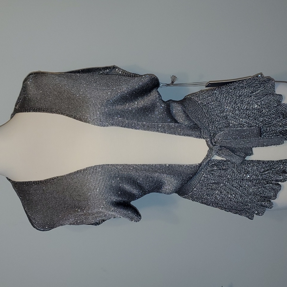 Cute silver top. Looks great with tank underneath